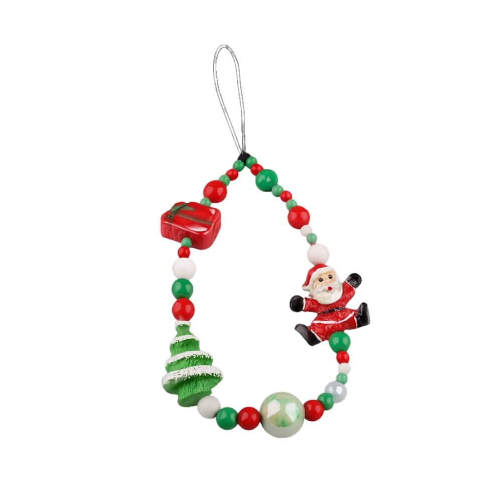Beaded Christmas ornament featuring red, green, and white beads, a Santa Claus figure, a snowy Christmas tree, and a red gift box