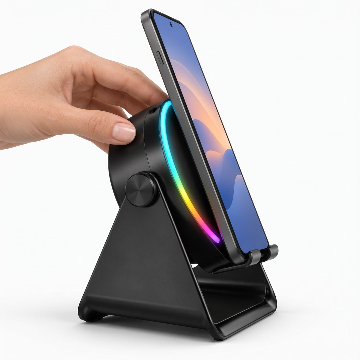 ViSound Tap seen from the side, a hand tilting the round face with a phone on the rest